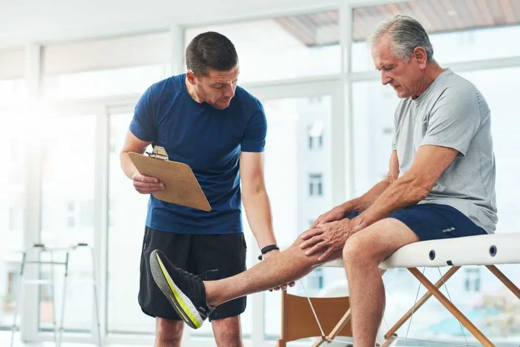 Physical therapist doing a consultation with a senior patient who is having an Arthritis 