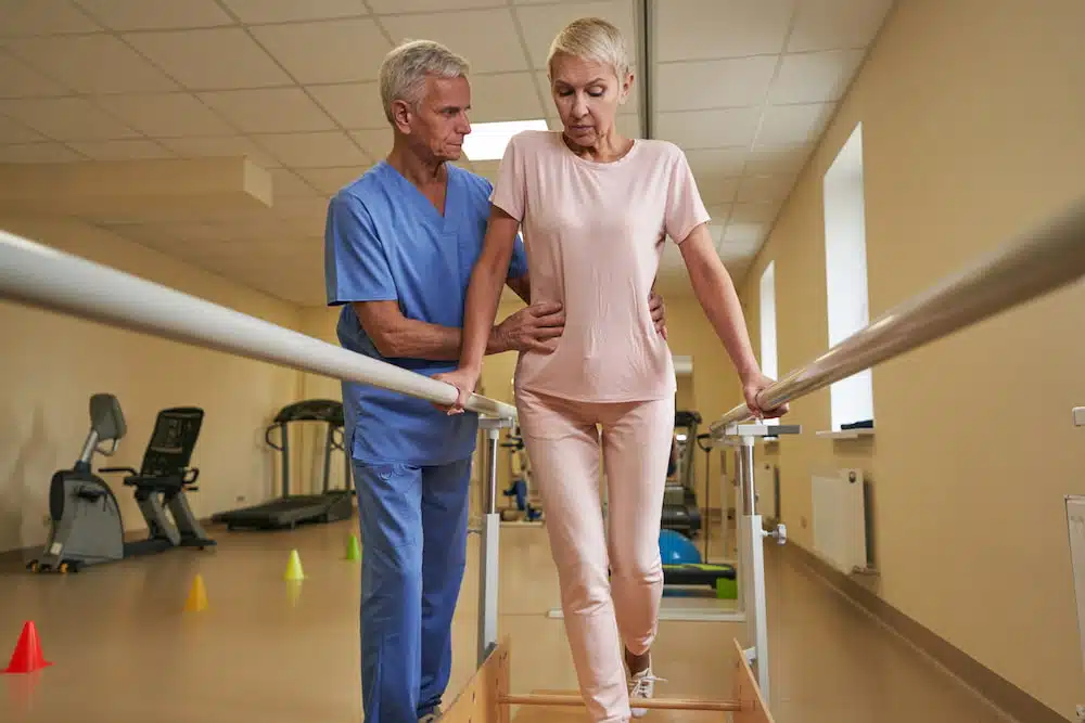 Neuromuscular Reeducation for legs on female stroke patient 