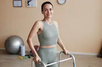 woman with impaired legs fully recovered and Restored Movement and Functionality after neuromuscular reeducation