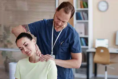 chiropractor treating patient's with car accident injury on the neck