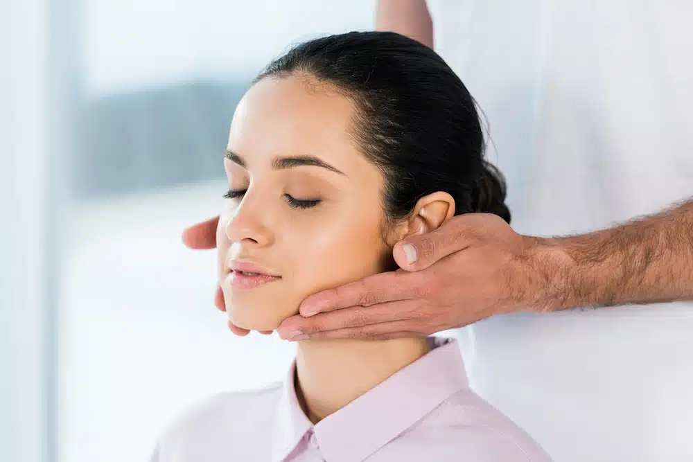 woman receiving noninvasive TMJ Treatment in Burbank