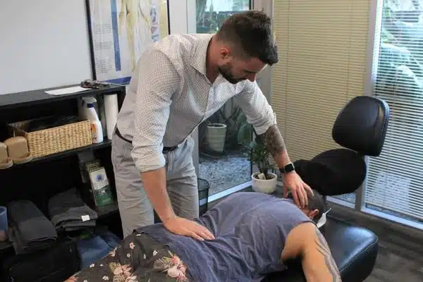 A man having a back chiropractic