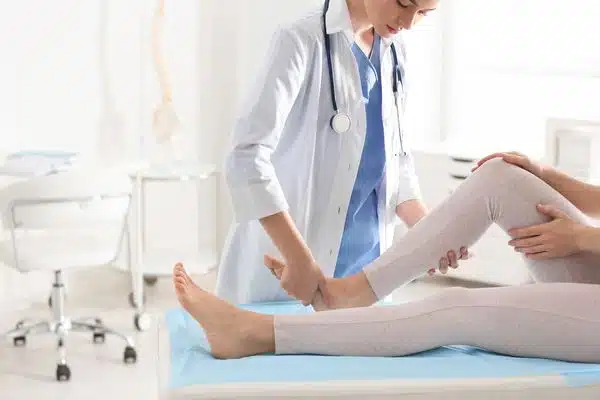 A woman having a foot chiropractic care